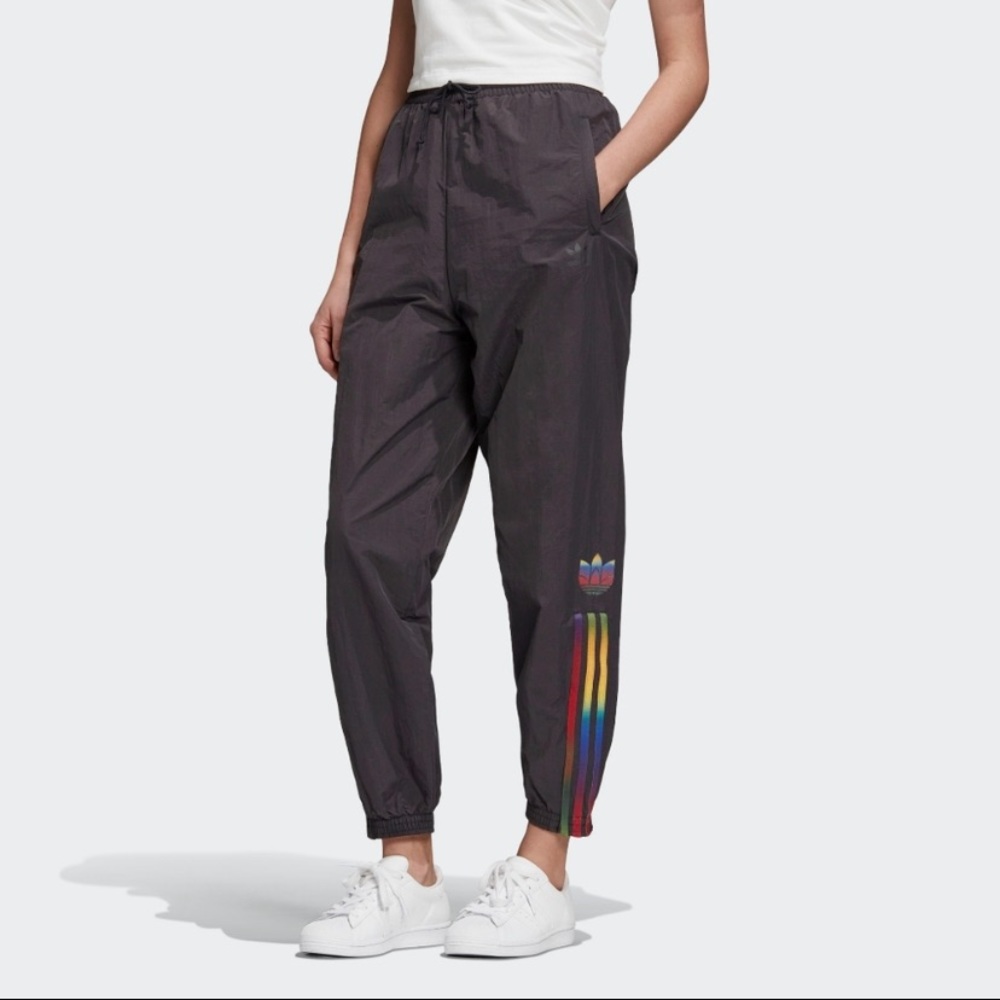 Adidas joggers with a rainbow stripe